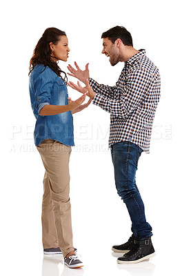 Buy stock photo Studio shot of a young couple arguing aggressively isolated on white