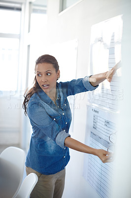 Buy stock photo Cropped shot of an attractive young woman giving a presentation