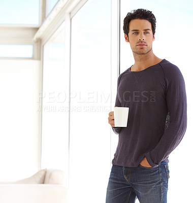 Buy stock photo Handsome, casual and man with coffee standing by the window in a vacation house. Calm, relax and attractive male person drinking a mug of latte in the living room while thinking or having a dream.