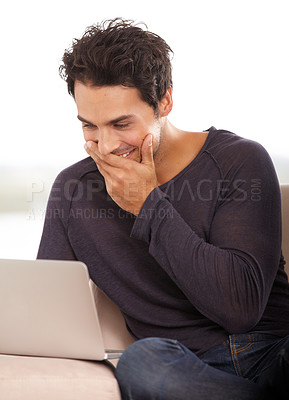 Buy stock photo Laugh, laptop and online with man on sofa for funny social media, networking and connection. Website, streaming and digital with person in living room at home for relax, research and technology