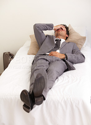 Buy stock photo Depression, bed and tired business man with burnout, stress or mistake or mental health crisis at home. Anxiety, fatigue or male workaholic in bedroom with headache, vertigo or frustrated by insomnia