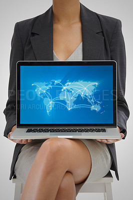 Buy stock photo Studio shot of a businesswoman holding a laptop showing a world map with locations on it