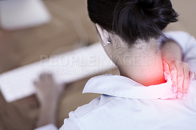 Buy stock photo Rearview shot of a businesswoman at her computer holding her aching neck, highlighted in red