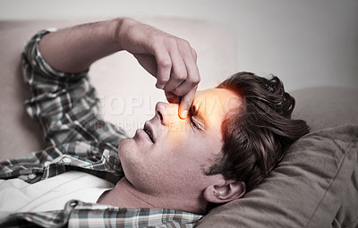 Buy stock photo A young man holding his head in pain