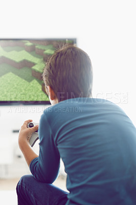 Buy stock photo Video, game and boy in home playing with internet connection, weekend and challenge from back. Technology, software and online gamer child in living room with computer screen for creative digital app