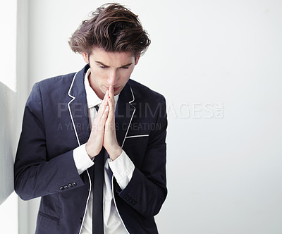 Buy stock photo Thinking, mistake and a businessman with a prayer in the office for support, hope and trust. Serious, idea and a young corporate employee with spiritual help for a decision or fail in the workplace