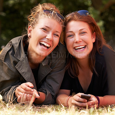 Buy stock photo Portrait, outdoor and women on the grass with smile, funny or happiness with vacation, relax or bonding together. Face, people on the ground or girls with joy, weekend break or getaway with summer