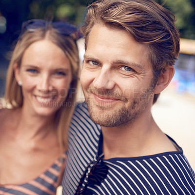 Buy stock photo Portrait of an attractive couple standing together and smiling