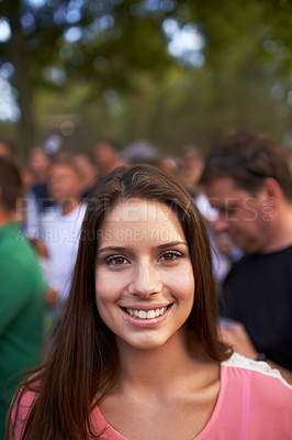 Buy stock photo Smile, music and festival with portrait of woman in crowd for celebration, party and energy. Holiday, new years concert and rock event with person in countryside for social, rave club or summer disco