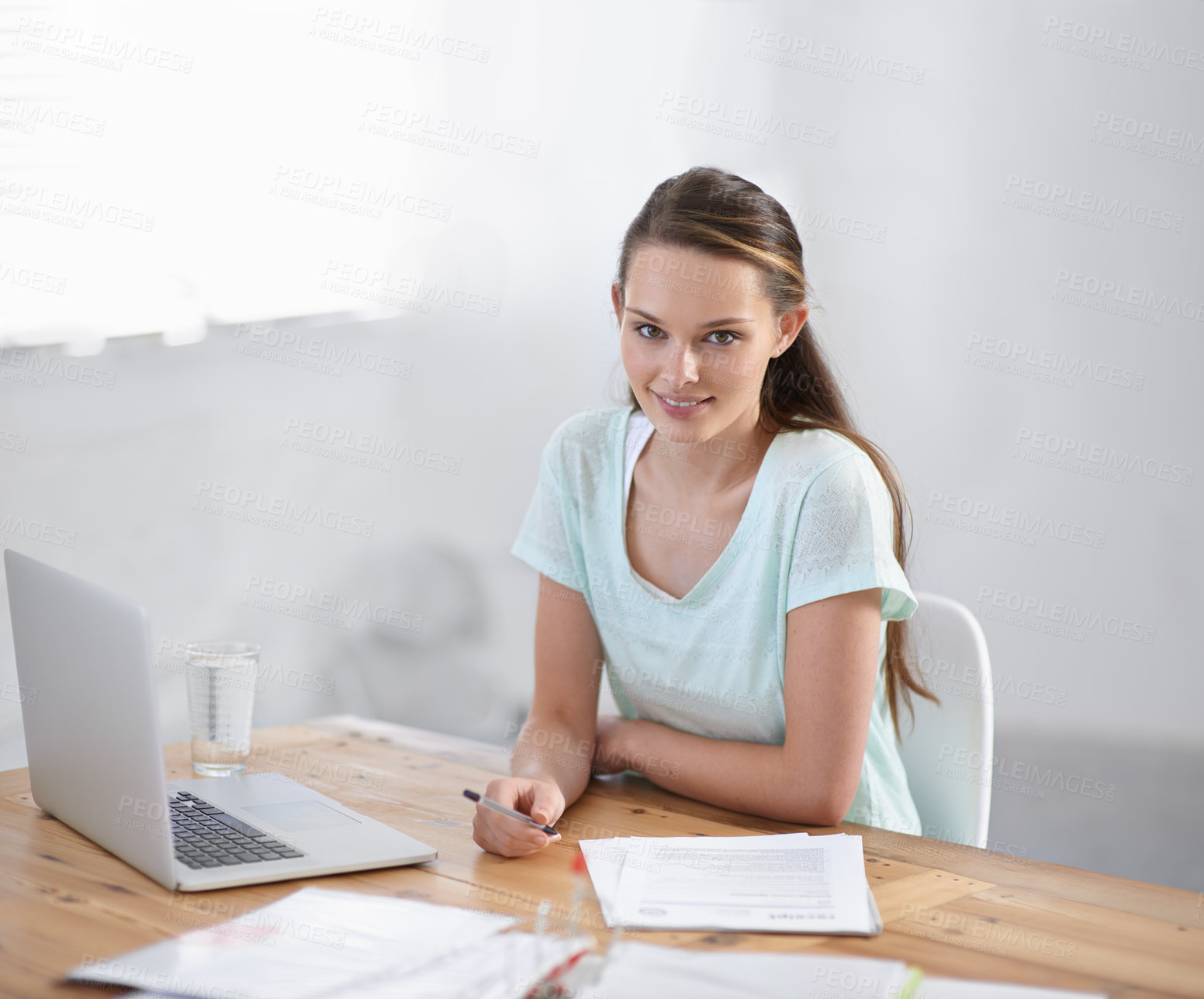 Buy stock photo Business woman, laptop and paperwork for planning, research and copywriting documents in office portrait. Young writer, editor or creative worker on her computer and editing article or job newsletter