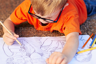 Buy stock photo Talented little boy drawing an incredibly advanced sketch