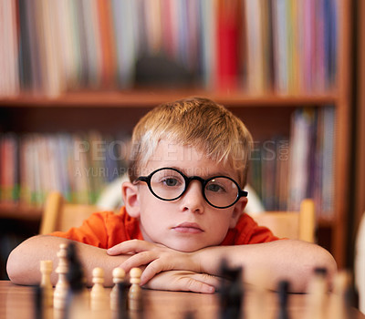 Buy stock photo Portrait, chess and boy with glasses, bored and competition with training, skills and clear vision. Face, person or kid with eyewear, tournament or game with thinking, contemplation, ADHD or solution