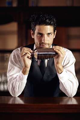 Buy stock photo Bartender, portrait and cocktail mixer for a drink, customer or dark club at night. Mixing, alcohol and face of barman with vodka or liquor in metal container or shaker for a strong beverage in a bar