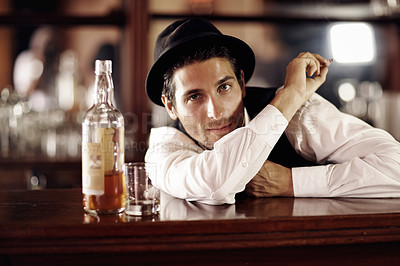 Buy stock photo Bartender man, portrait and bottle with smoking, service, drink at party, club or event. Male server, barman or waiter with glass for alcohol, spirit or whiskey to relax after work at restaurant