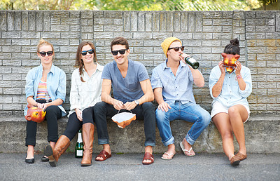 Buy stock photo Drinks, portrait and friends on a bench in public for costume masks, conversation and bonding on the weekend. Happy, group and people in the city for alcohol, communication and together for society