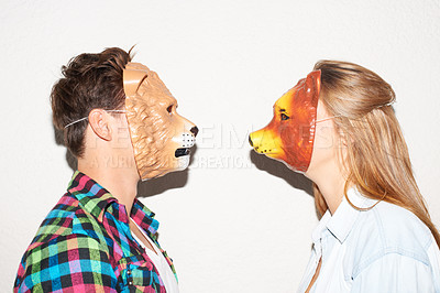 Buy stock photo Animal mask, party and a couple on a white background for fun, bonding or comedy. Funny, character and a man and woman with equipment for a comic date, social or at a halloween event together