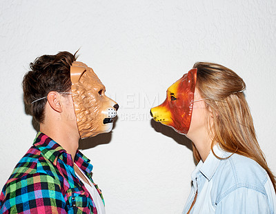 Buy stock photo Animal mask, funny and a couple on a white background for fun, bonding or comedy. Party, character and a man and woman with equipment for a comic date, social or at a halloween event together