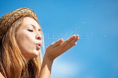 Buy stock photo Mockup, blue sky and a woman blowing glitter for celebration, event or a party in the city. Shimmer, closeup and a young girl with confetti or sparkle for a trend, wish or hope from a funky hipster