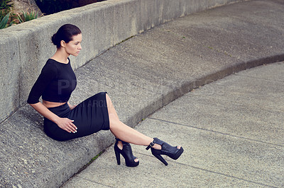 Buy stock photo Full length shot of a beautiful fashion model posing in an empty urban setting