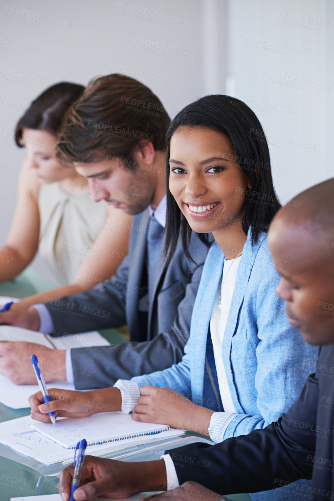 Buy stock photo Happy, portrait and businesswoman in meeting for strategy, teamwork and planning for project. Diversity, collaboration and brainstorming for company with pride and documents in conference room 