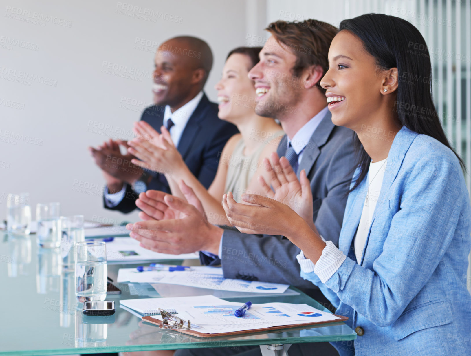 Buy stock photo Shot of businesspeople applauding a presentation at a work conference