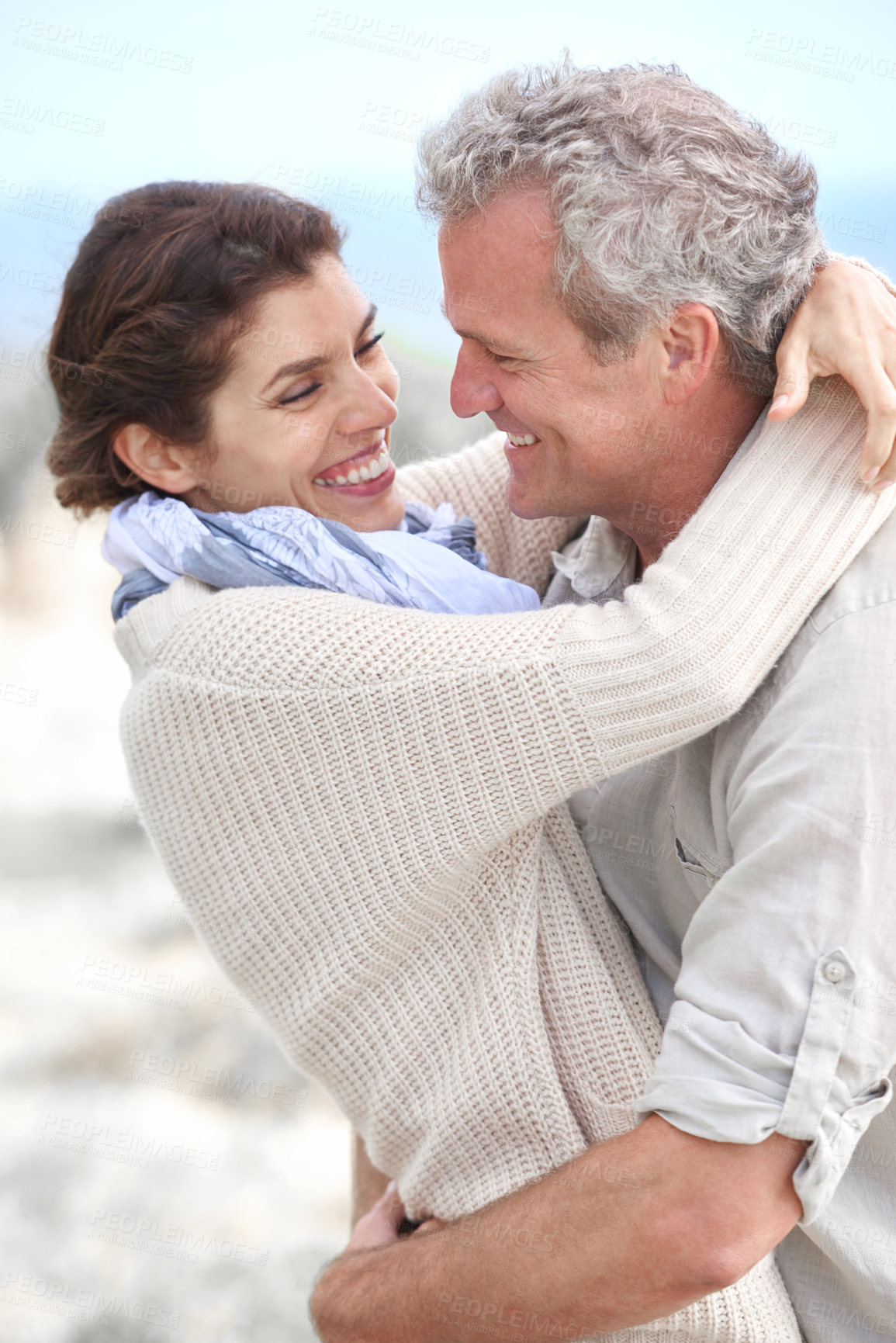 Buy stock photo Couple, face and laughing outdoor with hug for romance, love and relationship in nature with date. Mature, man and woman or embrace with happy, playful and joy for bonding, honeymoon and support 