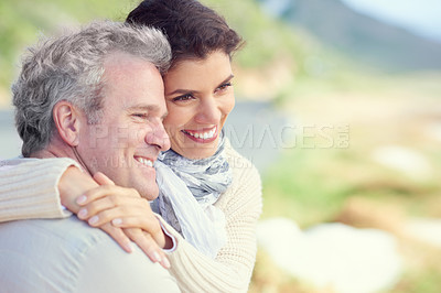 Buy stock photo Couple, face and smile outdoor with hug for romance, love and relationship in nature with comfort. Mature, man and woman or embrace with happy, relax and peace for bonding, honeymoon and support 