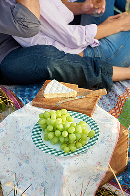 Buy stock photo Couple, cheese and grapes for picnic in park on anniversary, date or celebration together in summer. Healthy food, basket and people closeup on blanket, outdoor on grass and brunch, meal or snack