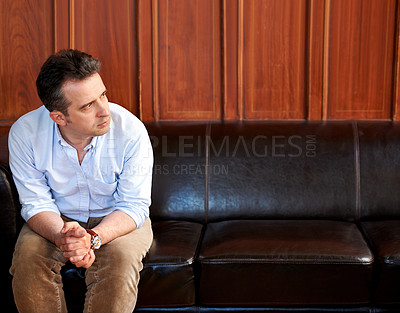 Buy stock photo Man, thinking and stress on sofa in waiting room for interview, recruitment or loss of job. Businessman, anxiety and sitting on couch with fear for unemployment, failure or problem in work mockup