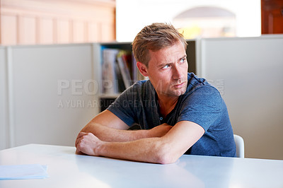 Buy stock photo Man, looking away and upset with paper on table in workspace for stress, worry and thinking for job. Young person, contemplate or anxious mindset indoor for problem, bad news and moody frustration 