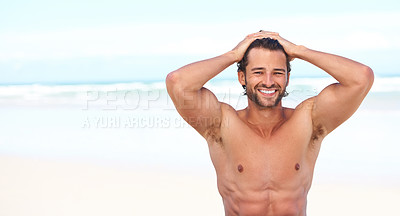 Buy stock photo Portrait, smile and space with a man on the beach in summer for travel, freedom or adventure on vacation. Sea, body and a happy young person shirtless on the sand with a blue sky on a tropical shore