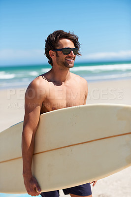 Buy stock photo Man, surfing and happy on vacation with sunglasses by the beach and sea for fitness and water sport with smile. Confidence, male person and surfboard for workout and training by ocean with freedom