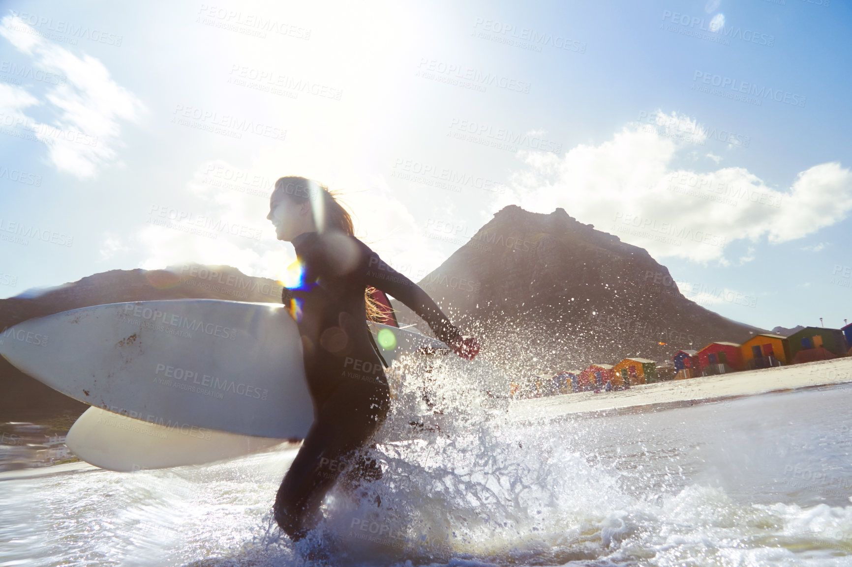 Buy stock photo Shot of a young couple out surfing together