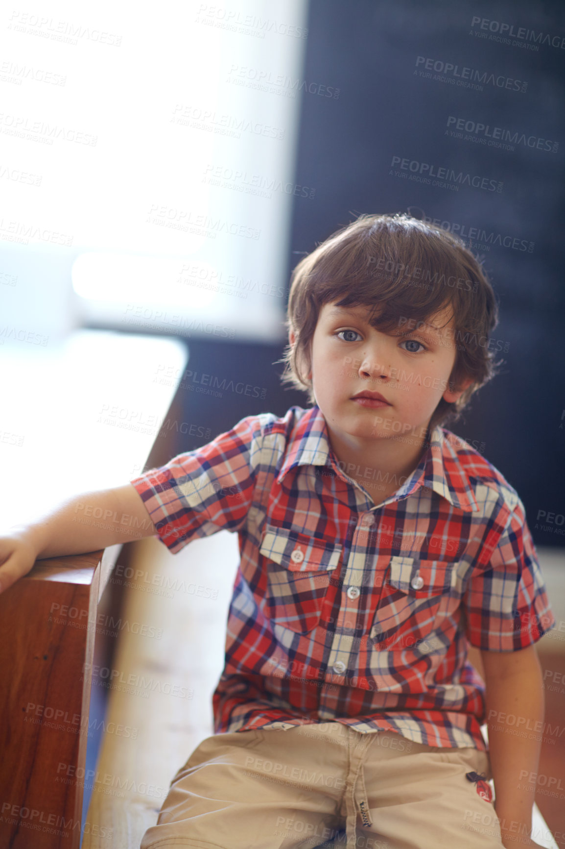 Buy stock photo Shot of a cute little boy looking at the camera