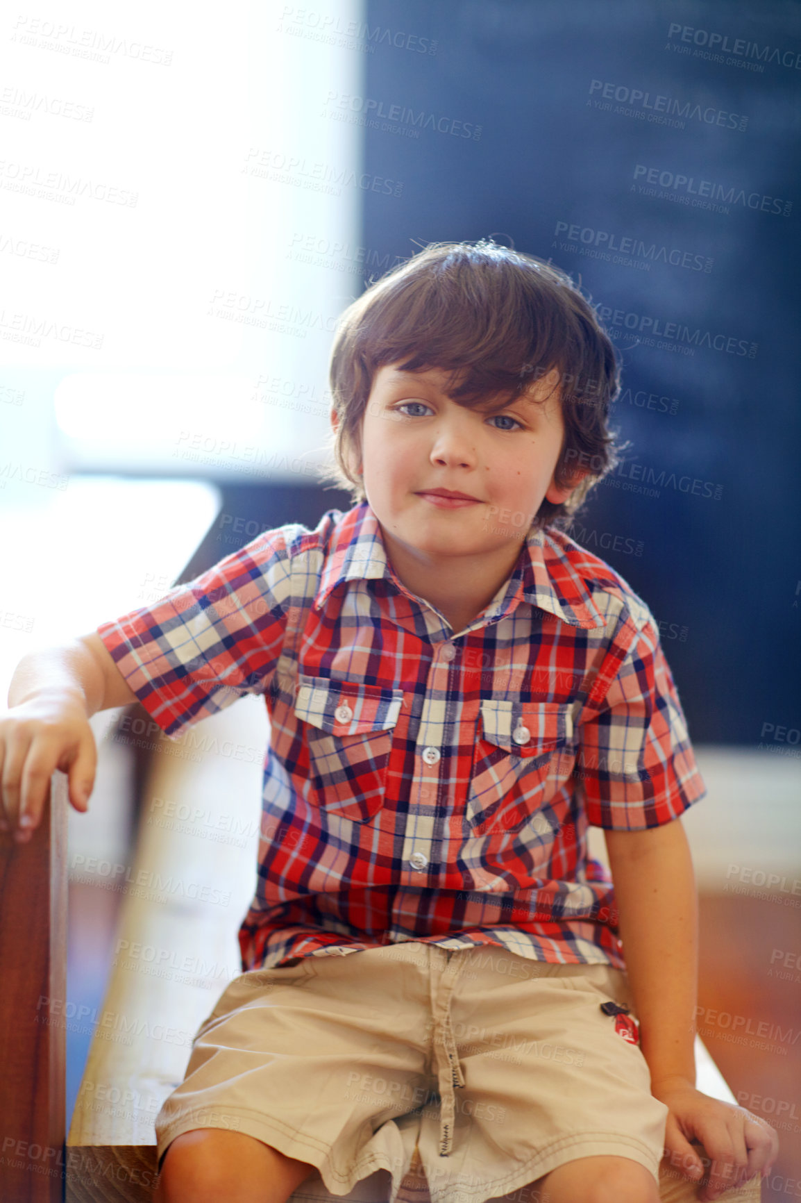 Buy stock photo Shot of a cute little boy looking at the camera