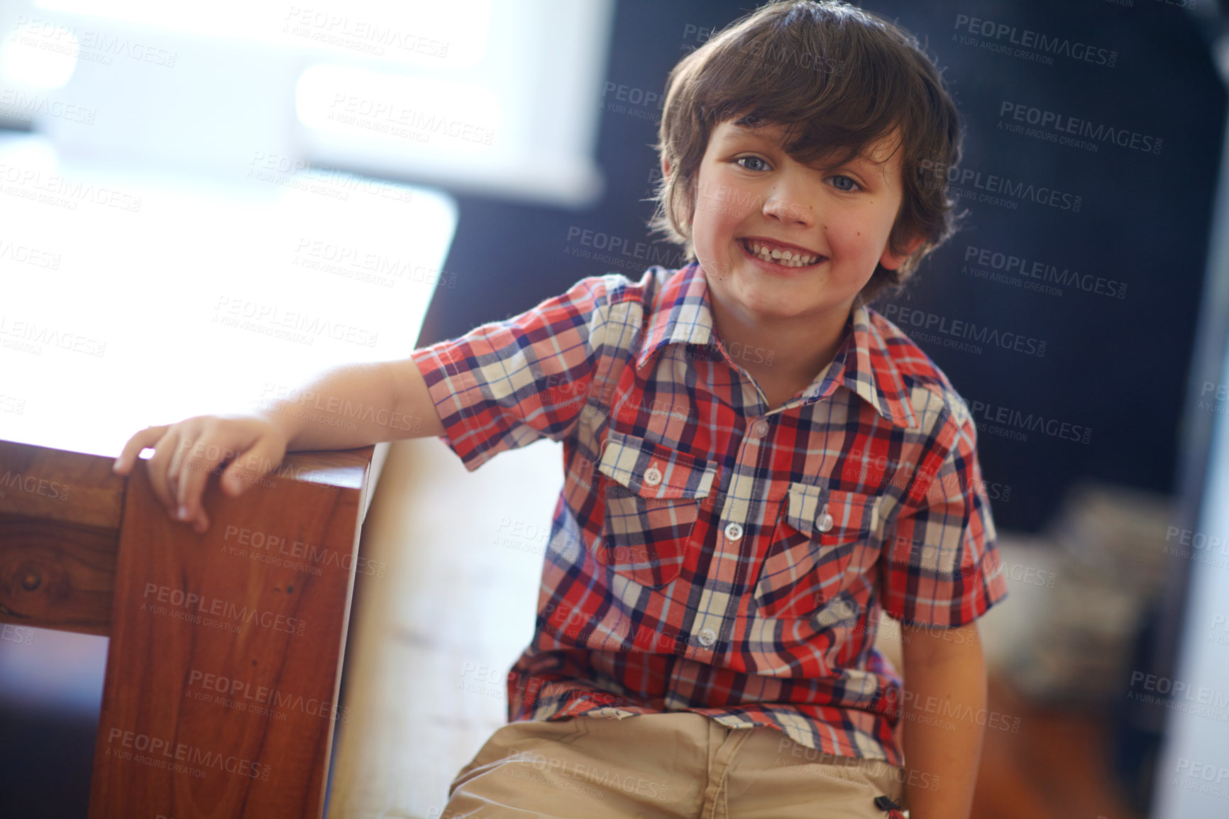 Buy stock photo Shot of a cute little boy looking at the camera