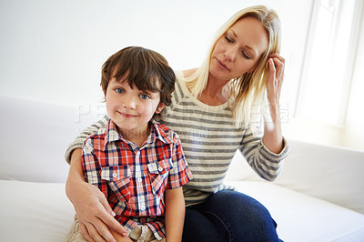 Buy stock photo Shot of a happy mother and son spending quality time together at home