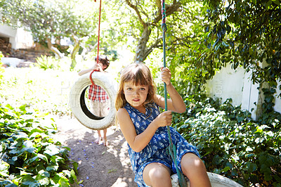 Buy stock photo Cropped shot of a young girl swinging in the yard
