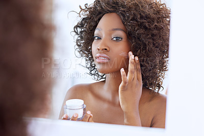 Buy stock photo Shot of a beautiful young woman during her daily beauty routine