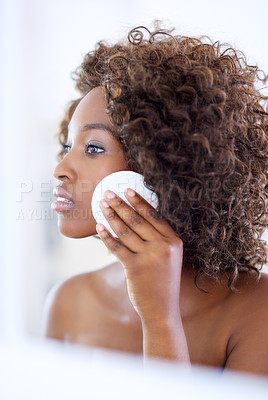 Buy stock photo Bathroom, cotton pad and black woman for makeup, washing face and wellness for morning routine. Dermatology, skincare and person in mirror for facial treatment, beauty and cosmetics for cleaning