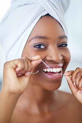 Buy stock photo Dental care, portrait and black woman with floss in bathroom for fresh breath in home. Happy, oral health and African person cleaning teeth with thread for cavity, plaque removal and wellness.