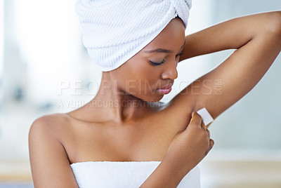 Buy stock photo Beauty, skincare and black woman waxing armpit in bathroom with getting ready for smooth skin. Morning routine, underarm hair removal and girl at bath with towel, cosmetics and grooming in home