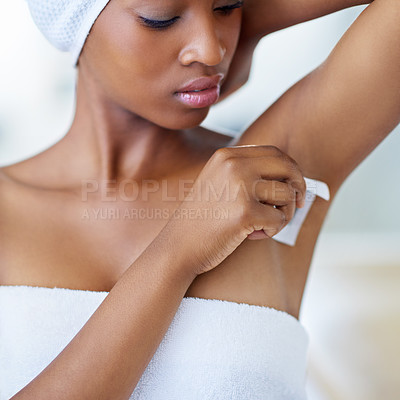 Buy stock photo Beauty, hygiene and black woman waxing armpit in bathroom with getting ready for smooth skin. Morning routine, skincare and girl with underarm hair removal, towel and cosmetic grooming in home