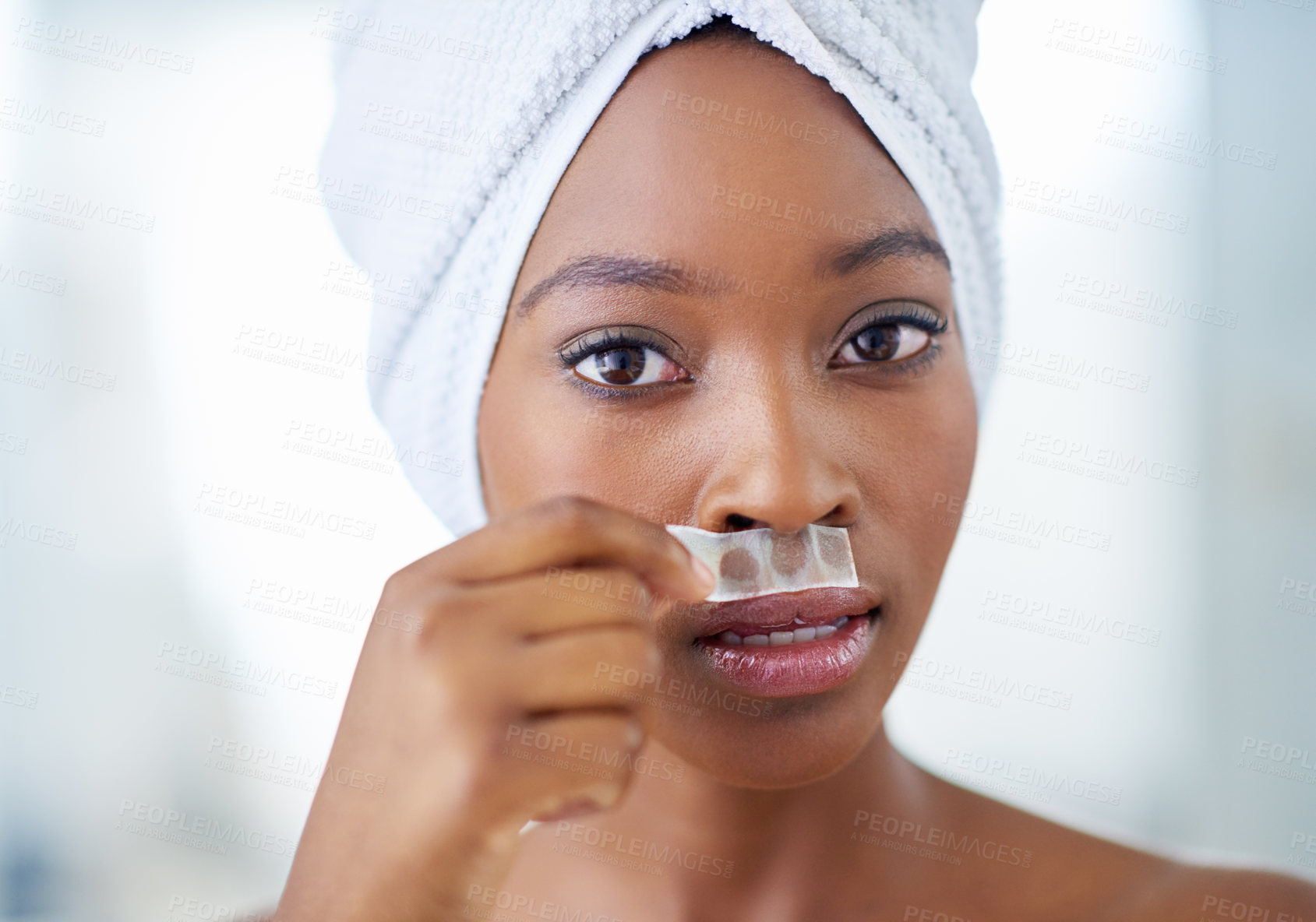 Buy stock photo Black woman, portrait and beauty with wax strip for facial hair, hygiene or grooming routine at home. Young African, female person or model with epilation treatment on upper lip for smooth skin