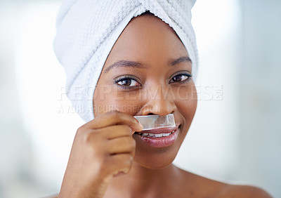 Buy stock photo Black woman, portrait and skincare with wax strip for hair removal for facial, hygiene or grooming at home. Happy African, female person or model with smile for epilation treatment or smooth skin