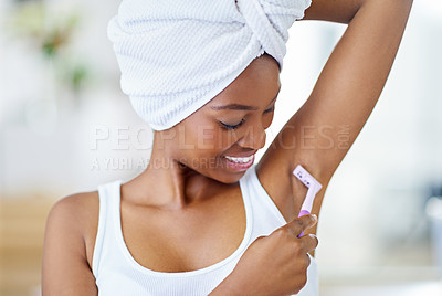 Buy stock photo Hygiene, beauty and black woman shaving armpit in bathroom, getting ready and smooth skin with razor. Morning routine, hygiene and girl with underarm hair removal product, towel or cosmetics in home