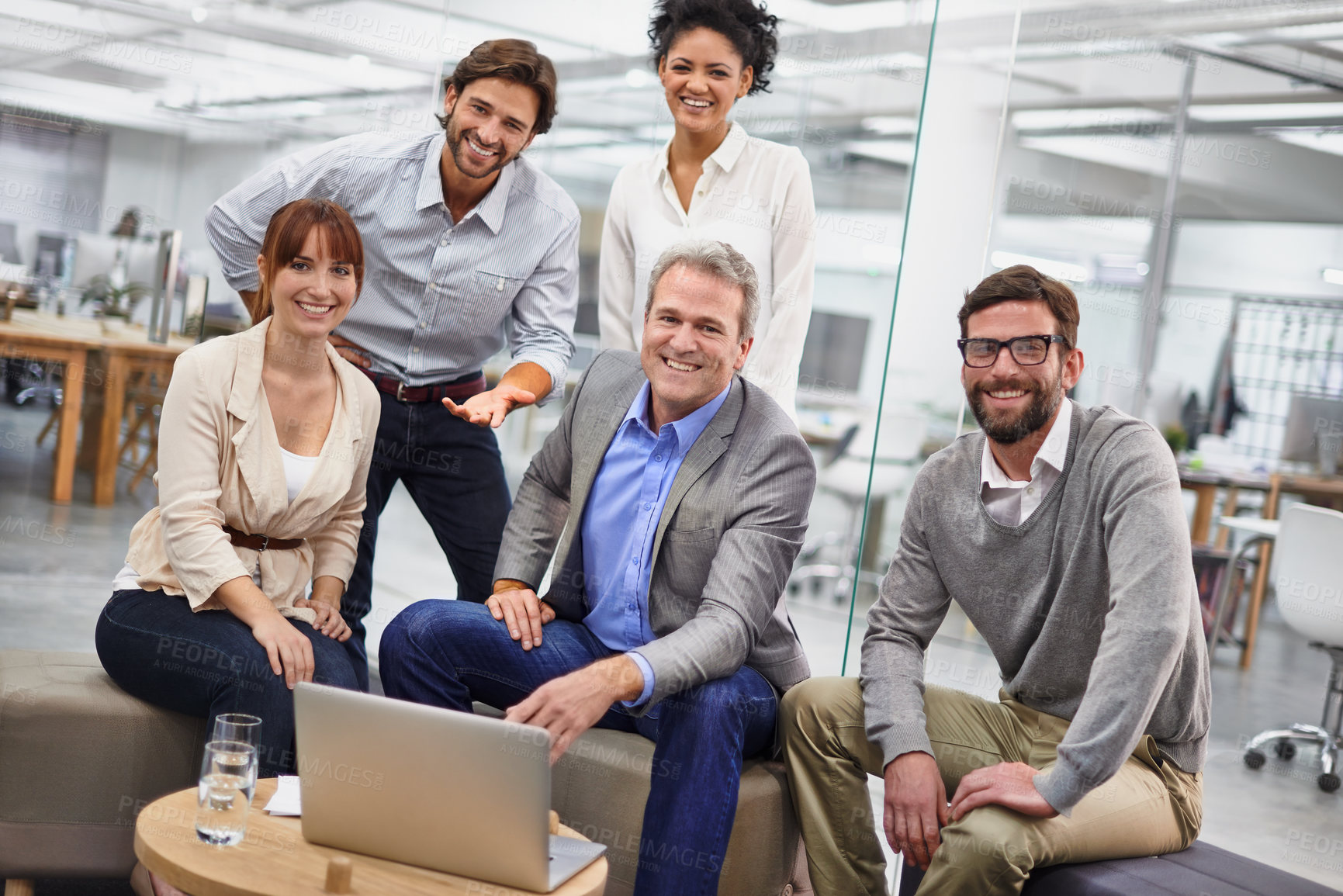 Buy stock photo Businesspeople, portrait and laptop for collaboration in office at creative agency for project planning, campaign or proposal. Men, women and smile or together for web teamwork, internet or meeting