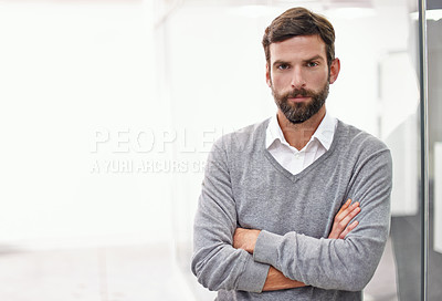 Buy stock photo Portrait of a handsome young businessman standing in his office
