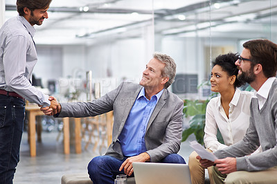 Buy stock photo Business people, handshake and meeting with team for agreement, partnership or b2b at office. Businessman or employees shaking hands for greeting, deal or collaboration in discussion at workplace