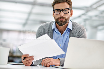 Buy stock photo Businessman, portrait and laptop with paperwork in finance, budget planning or investment at office. Man, accountant or employee with documents, financial report or policy by computer at workplace